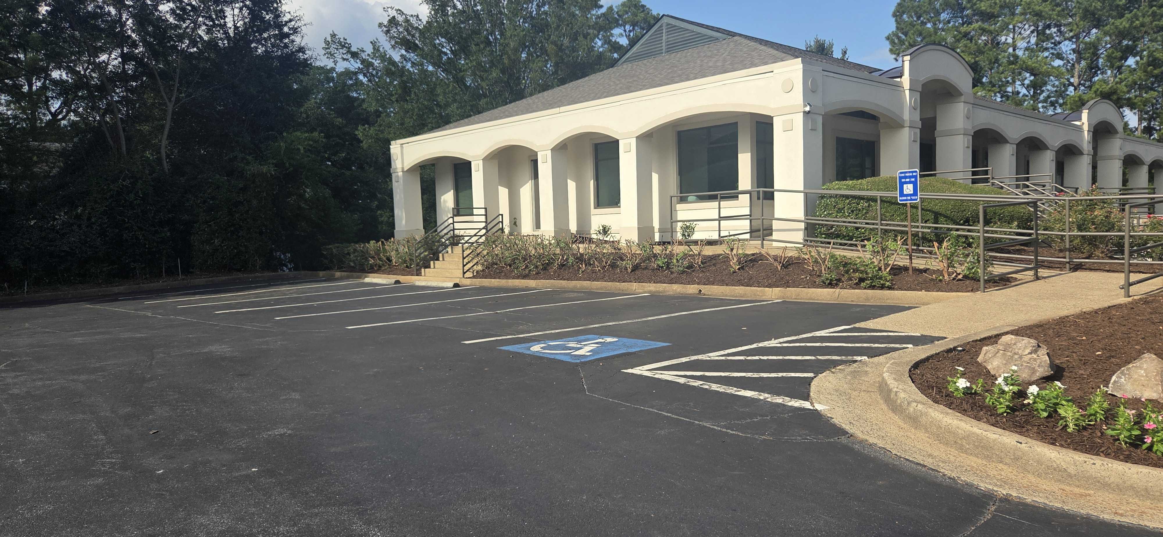 Commercial Cleanup and Mulching by Parking Lot
